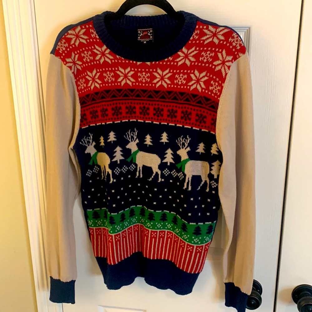 Christmas sweater with argyle print style snowflakes and reindeer